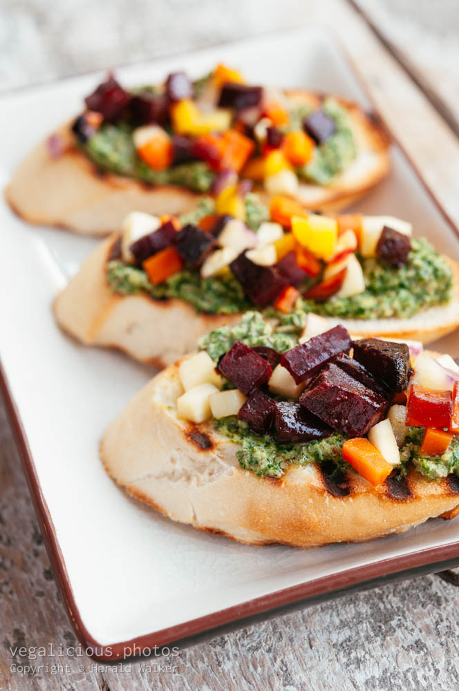 Stock photo of Roasted Fall Veggie Bruschetta with Kale, Sage and Chive Pesto