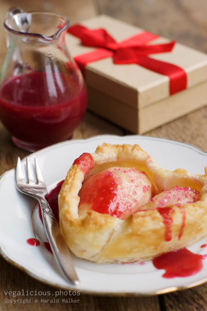 Stock photo of Pear Heart Tarts with Red Current Sauce