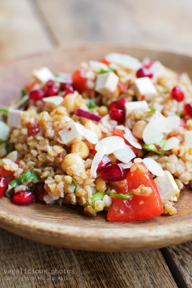 Stock photo of Bulgur Tomato Salad with Pomegranate Arils Mint and Almonds