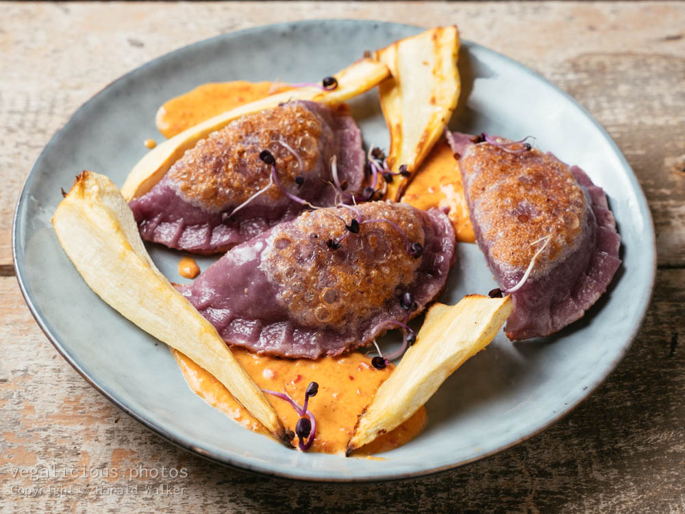 Stock photo of Purple Pot Stickers with Parsnips and Paprika Sauce