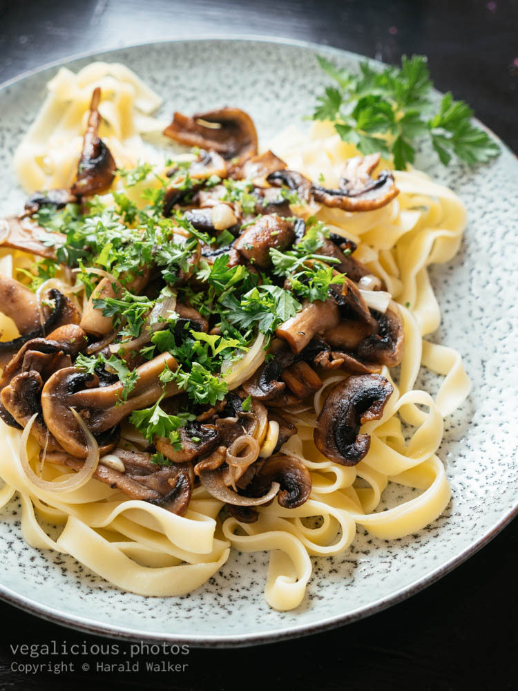 Stock photo of Garlicky Mushrooms on Pasta
