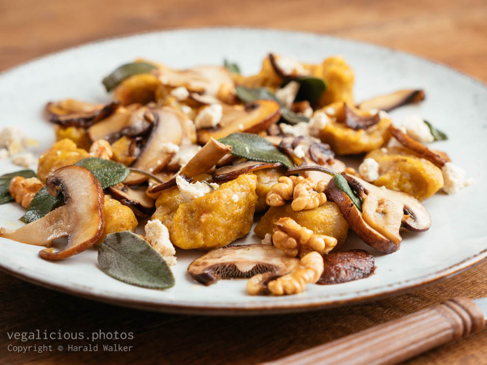 Stock photo of Pumpkin Gnocchi with Mushrooms and Walnuts, Sage Buttered Sauce
