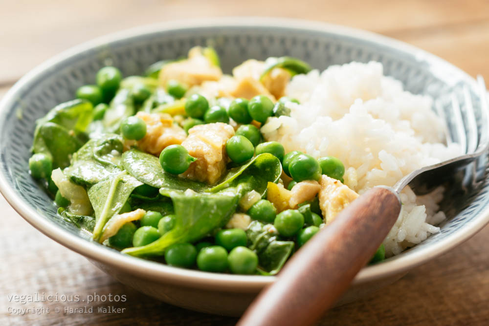 Stock photo of Vegan Thai Green Curry with Chickun, Spinach and Fresh Garden Peas