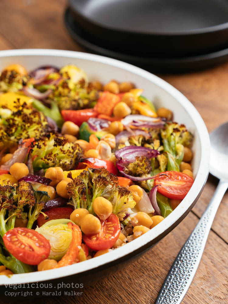 Stock photo of Roasted Purple Sprouting Broccoli, Brussels Sprouts and Peppers on Quinoa