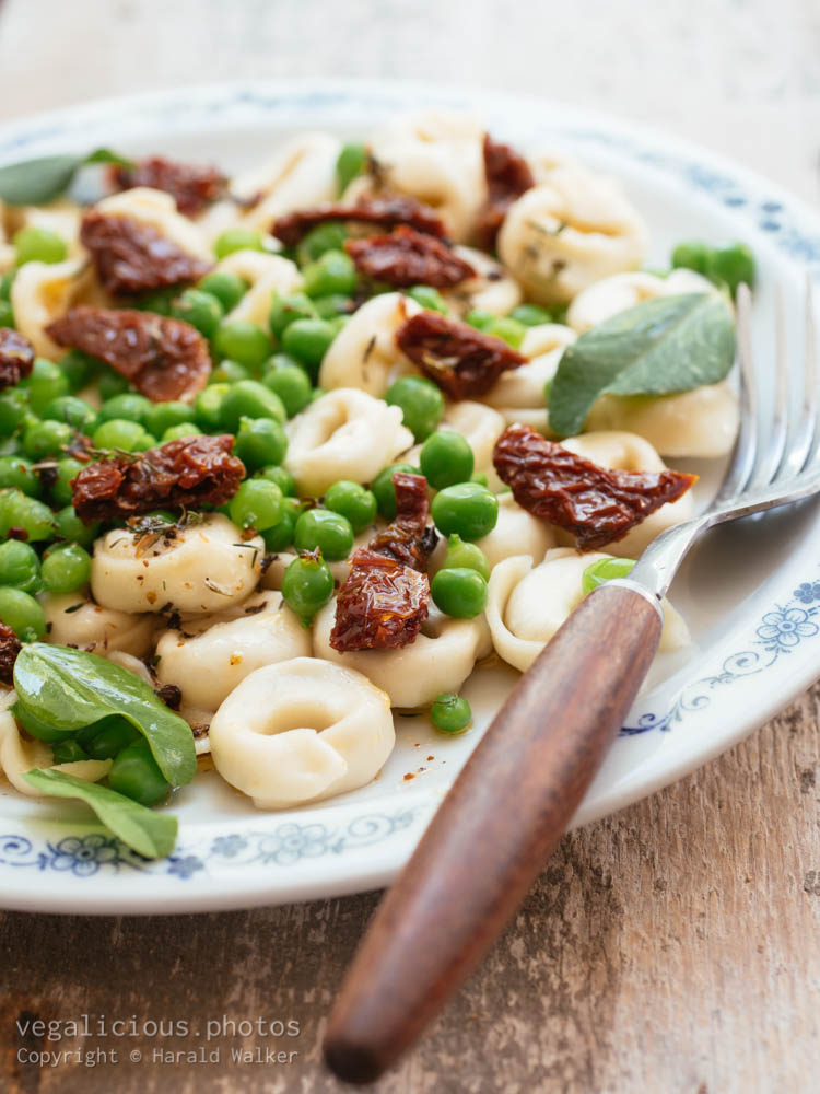 Stock photo of Tortellini with Fresh Garden Peas and Sun-dried Tomatoes