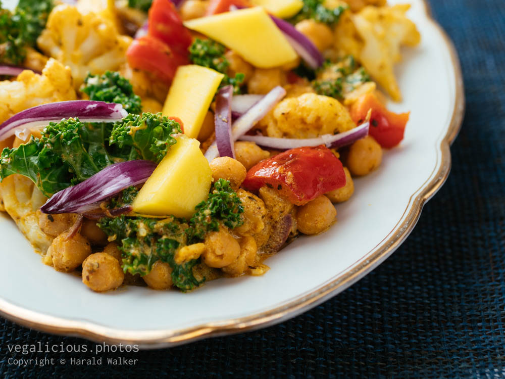 Stock photo of Chickpea, Cauliflower Curry with Kale and Mango