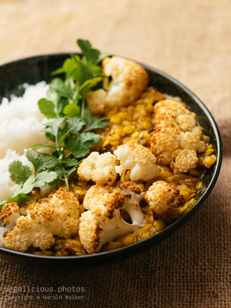 Stock photo of Roasted cauliflower with curried Lentils and Rice