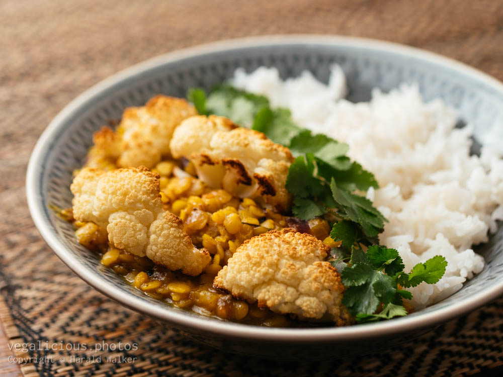 Stock photo of Roasted cauliflower with curried Lentils and Rice