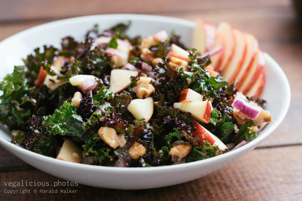 Stock photo of Kale Salad with Apples, Walnuts, Cranberries and Red Onions