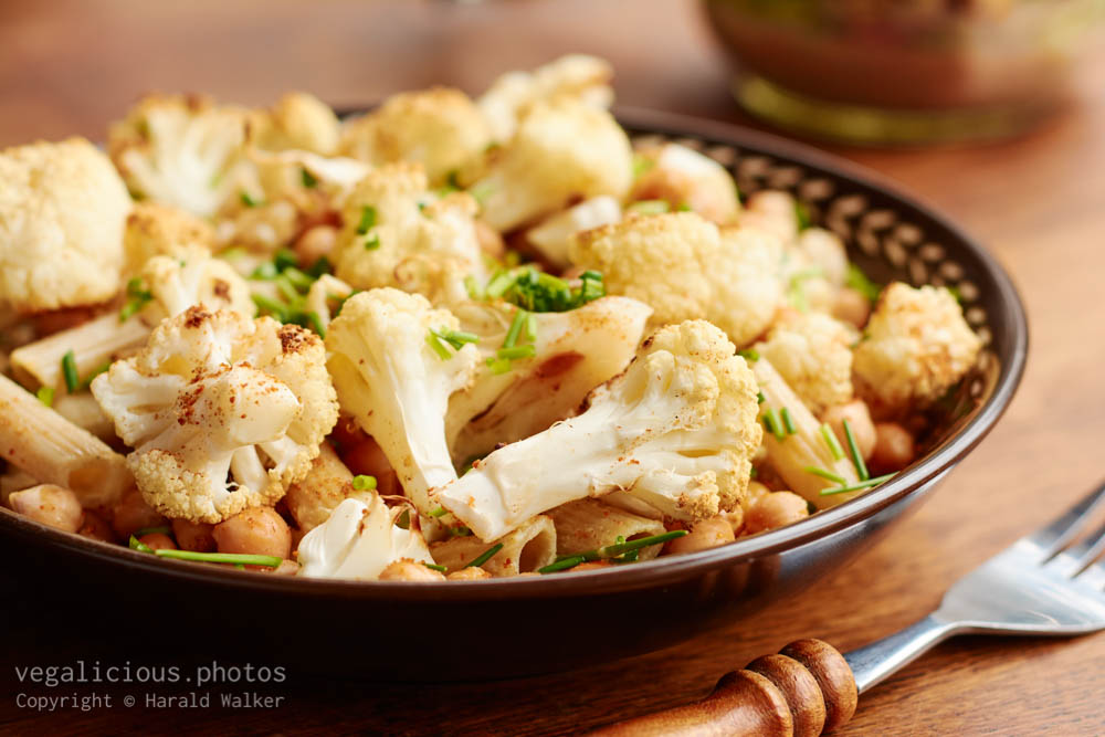 Stock photo of Spicy Roasted Cauliflower And Chickpeas on Penne Pasta
