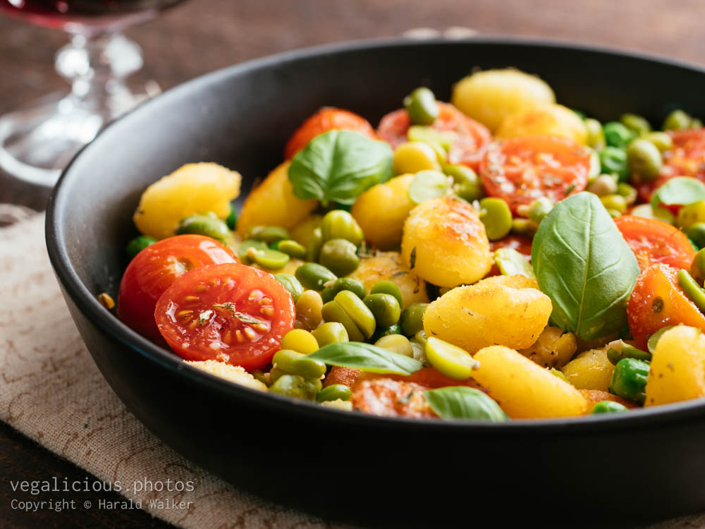 Stock photo of Roasted gnocchi with legumes