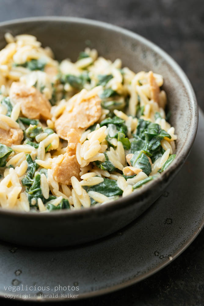 Stock photo of Garlicky Orzo with Vegan Creamed Spinach and Chickun