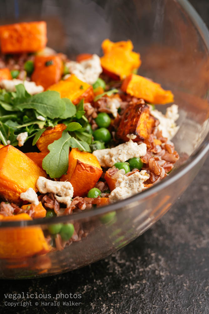 Stock photo of Roasted Winter Squash with Red Rice, Peas and Carrots
