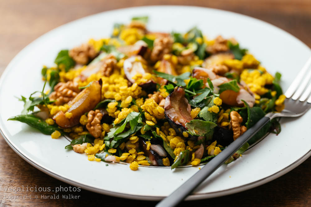 Stock photo of Spinach and Plum Salad with Curried Lentils