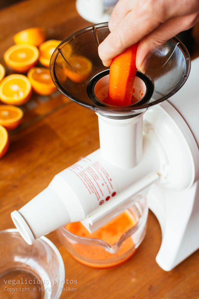 Stock photo of Carrot in a juicer