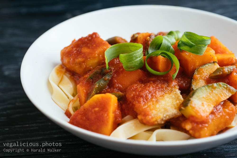 Stock photo of Sweet and spicy vegetables and tofu on pasta