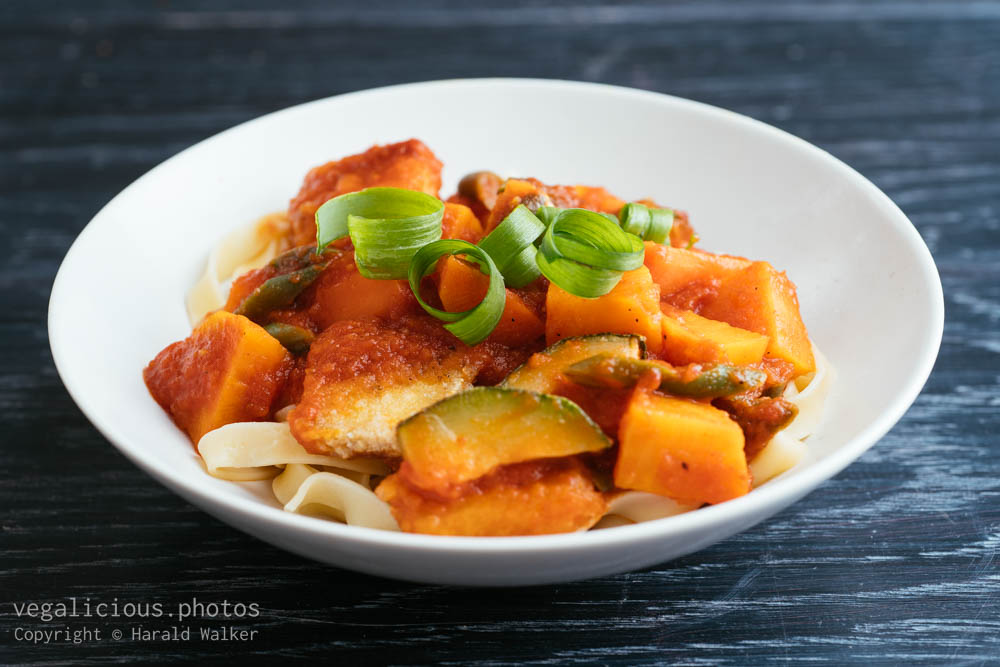 Stock photo of Sweet and spicy vegetables and tofu on pasta