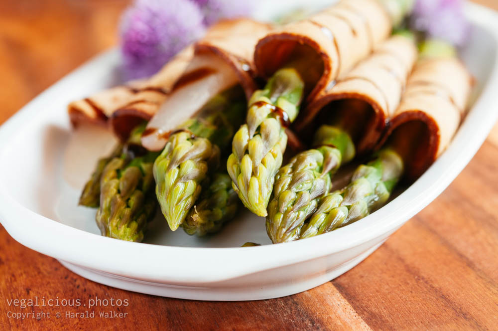 Stock photo of Asparagus and Pears Wrapped In Vegan Cold Cuts