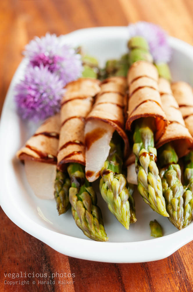 Stock photo of Asparagus and Pears Wrapped In Vegan Cold Cuts