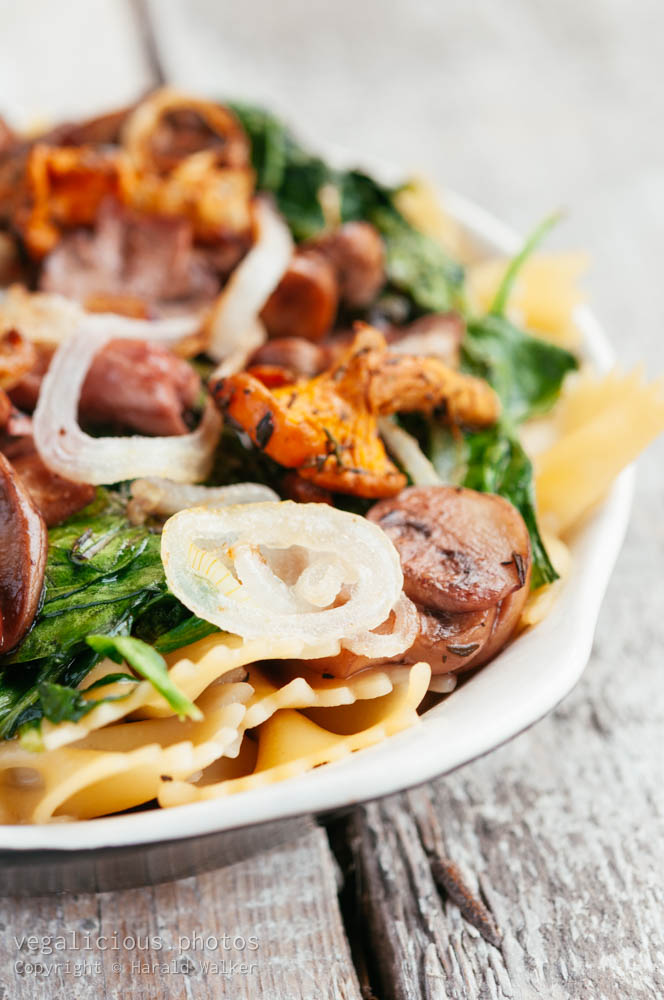 Stock photo of Mixed Mushrooms and Spinach on Pasta