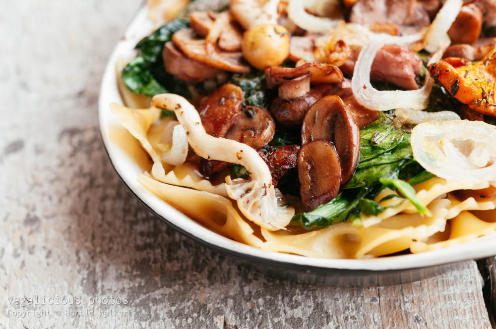 Stock photo of Mixed Mushrooms and Spinach on Pasta