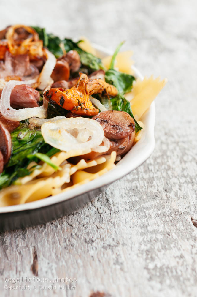 Stock photo of Mixed Mushrooms and Spinach on Pasta