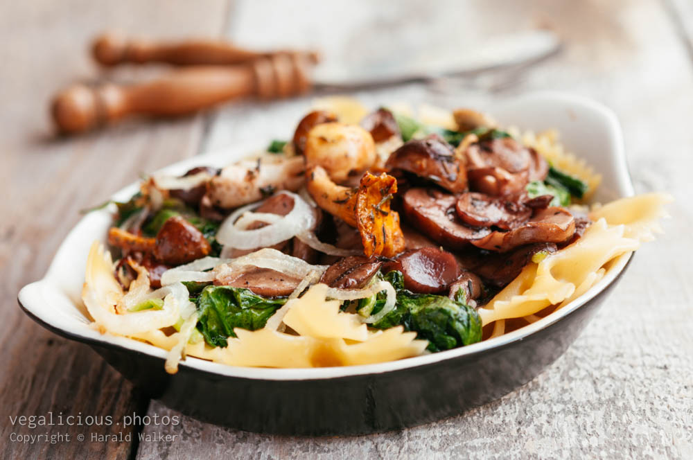 Stock photo of Mixed Mushrooms and Spinach on Pasta