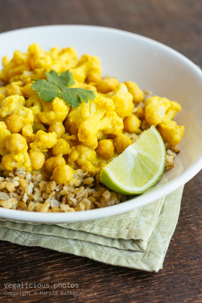 Stock photo of Curried Cauliflower and Chickpeas on Freekeh