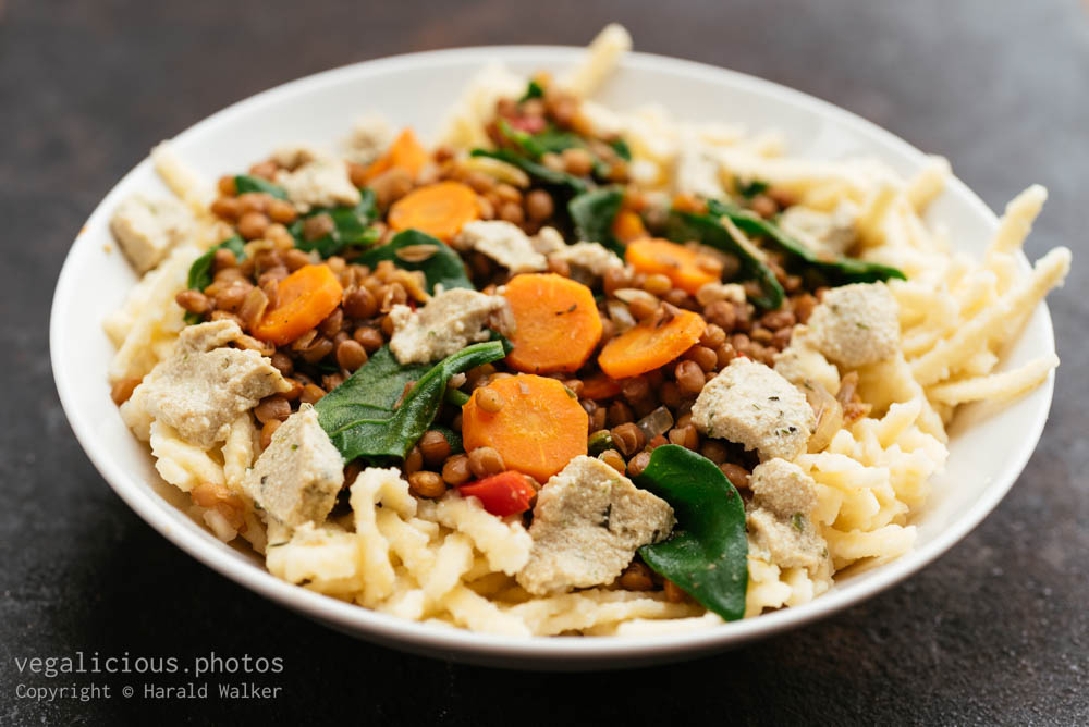 Stock photo of Lentils with spinach and Vegan Feta on Spaetzle