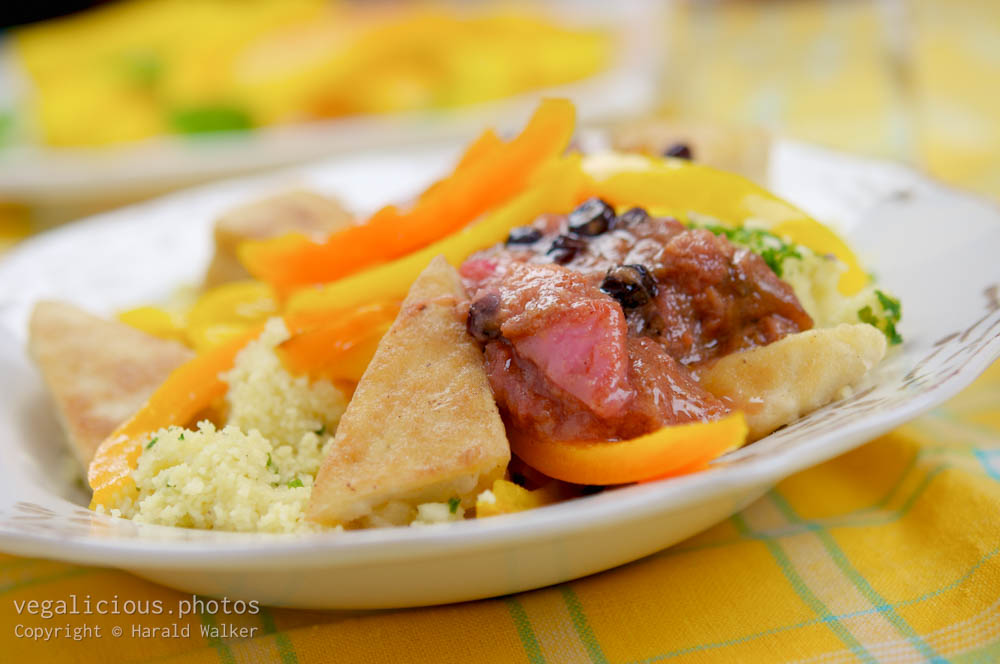 Stock photo of Tofu Cutlets On Couscous with Sweet Peppers and Rhubarb Chutney