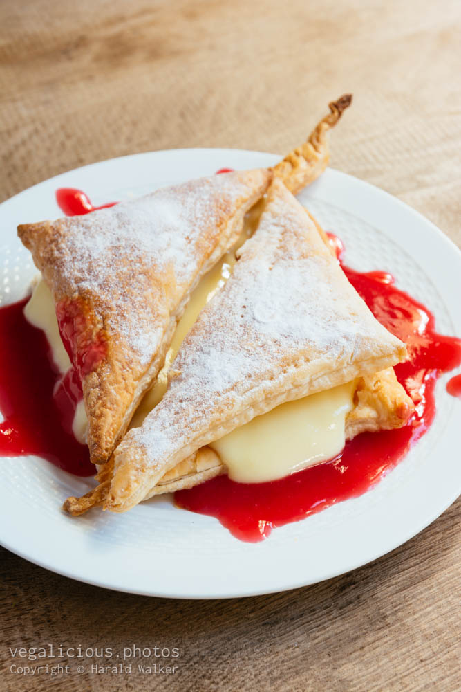 Stock photo of Vanilla Pudding and Puff Pastry with Red Currant Sauce