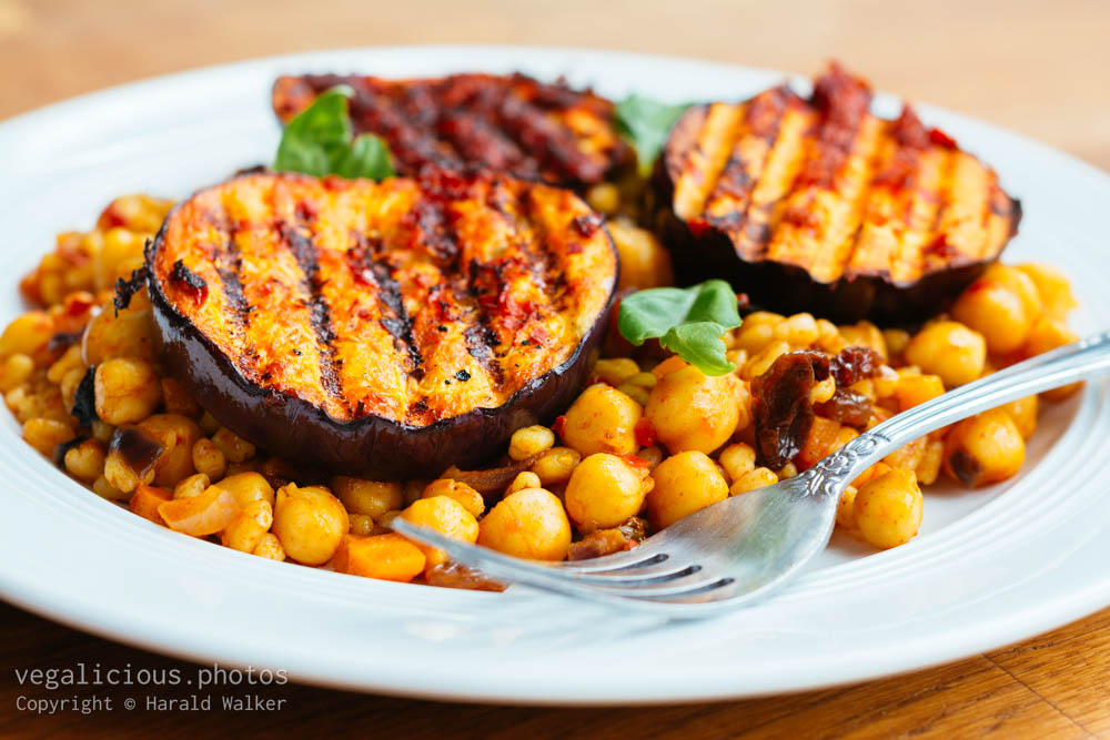 Stock photo of Grilled Eggplant with Harissa on Wheatberry Pilaf