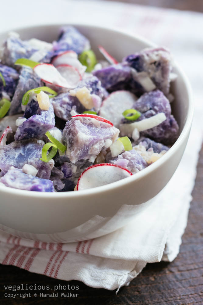 Stock photo of Purple potato salad with radishes