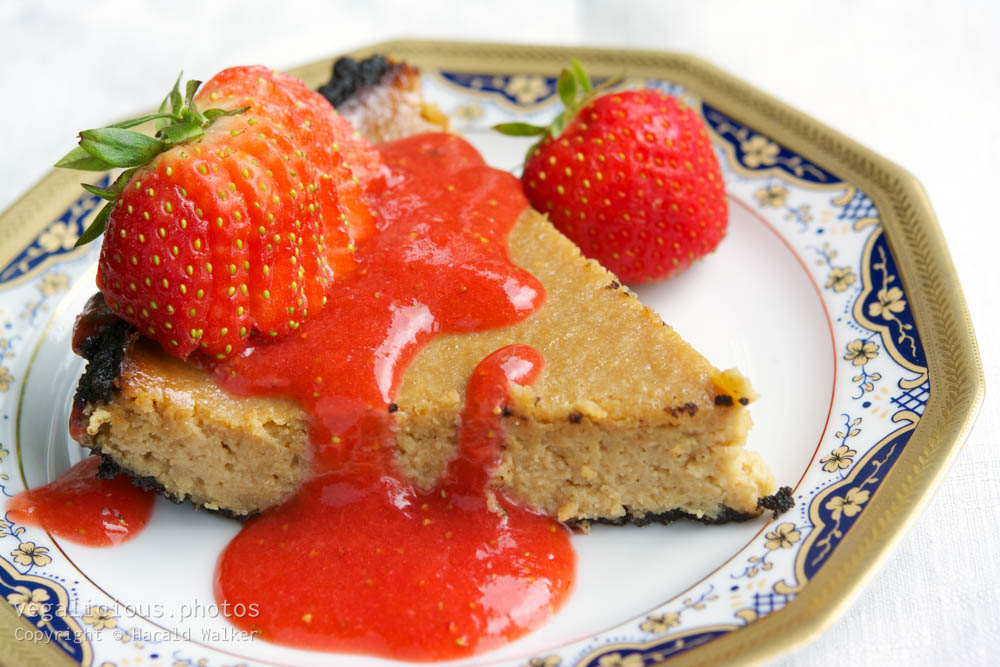 Stock photo of Vegan Cheesecake with Chocolate Bottom and Strawberry Coulis