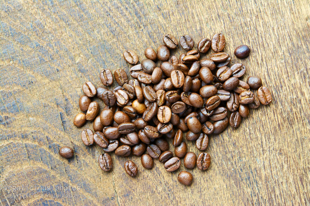 Stock photo of Organic espresso beans on wood