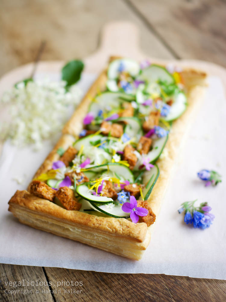 Stock photo of Springtime Zucchini Tart with Edible Flower Garnish