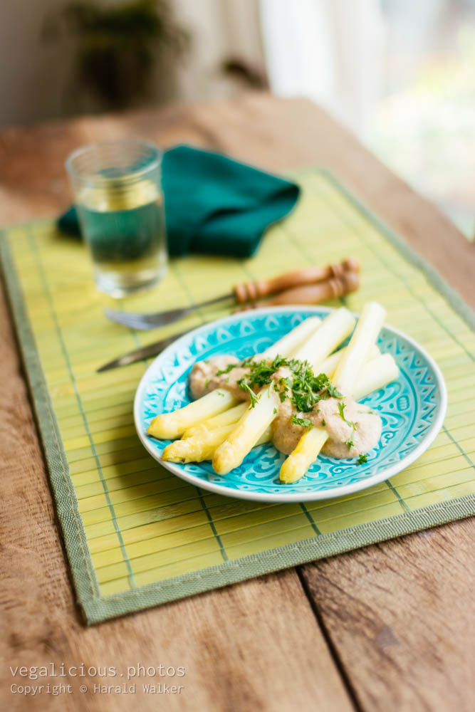 Stock photo of White asparagus with cashew cream sauce