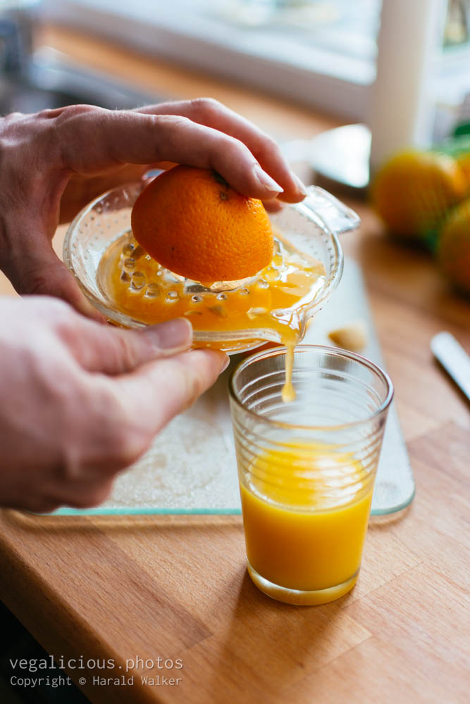 Stock photo of Pouring freshly orange juice