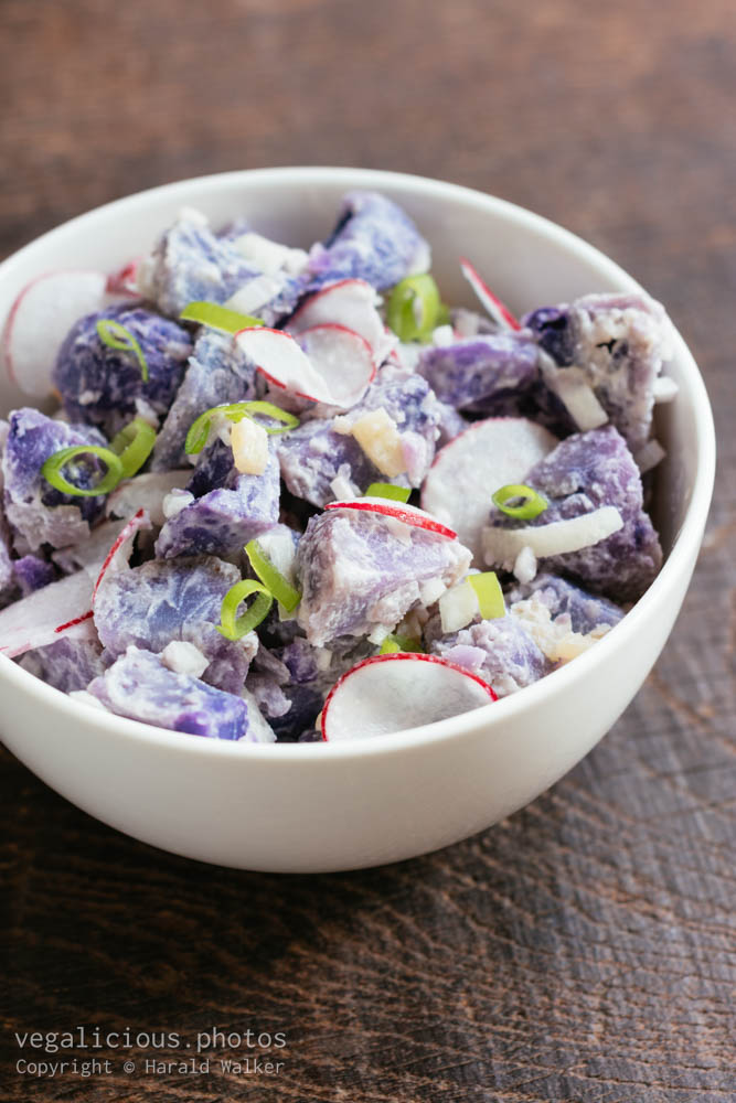 Stock photo of Purple potato salad with radishes