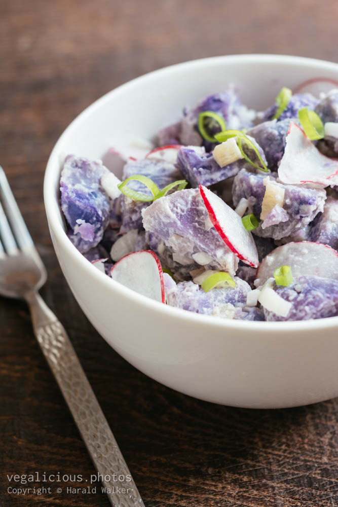 Stock photo of Purple potato salad with radishes