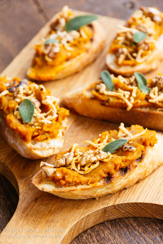 Stock photo of Pumpkin bruschetta with toasted walnuts, soy cheese and sage