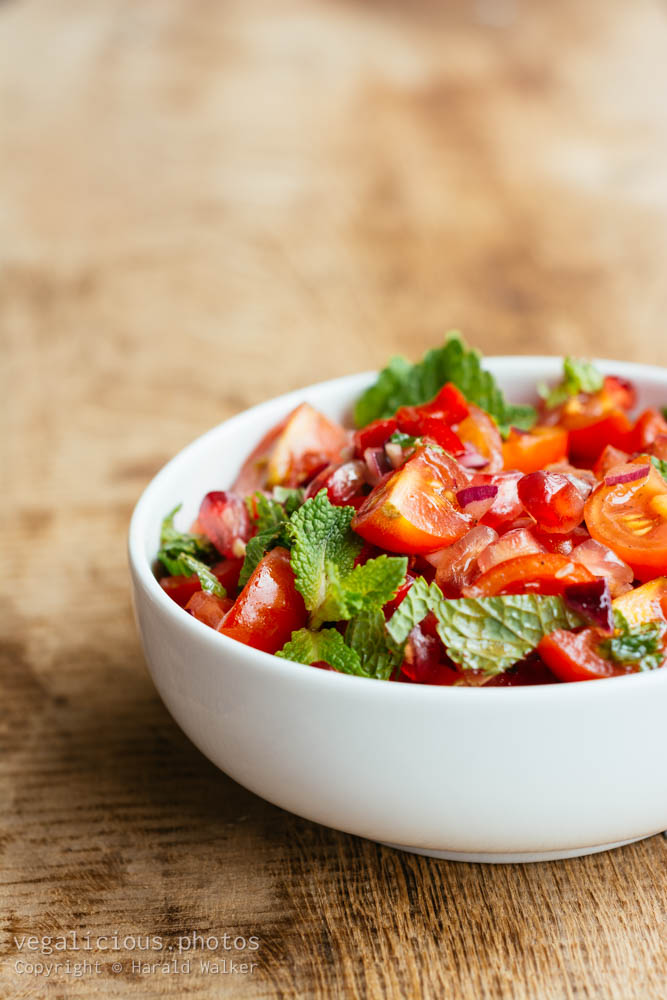 Stock photo of Tomato and pomegranate salad