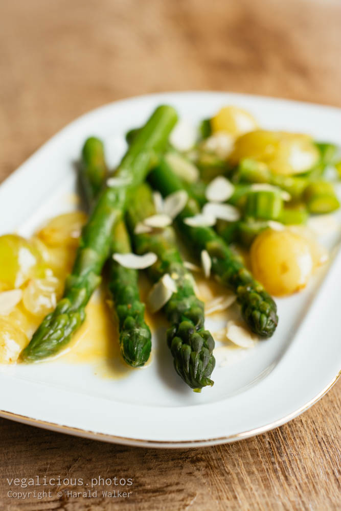 Stock photo of Green asparagus with sauteed grapes