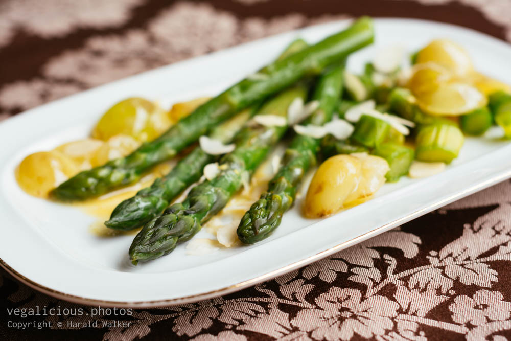 Stock photo of Green asparagus with sauteed grapes